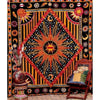 Bohemian mandala tapestry wall hanging featuring a large, intricate design with sunbursts and celestial elements.