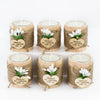 Six natural wooden candle holders wrapped in twine with a thank you message tag