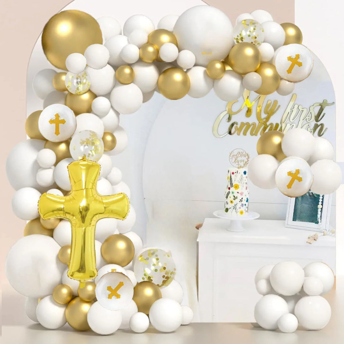 A white and gold balloon garland arch kit decorated for a first communion celebration.