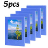 Five blue magnetic photo frames or fridge magnets displayed in a row.