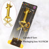 A gold 3D crown number candle for birthdays and celebrations is shown in a packaging box.