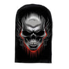 A black fabric mask featuring a stylized skull design with dripping red paint.