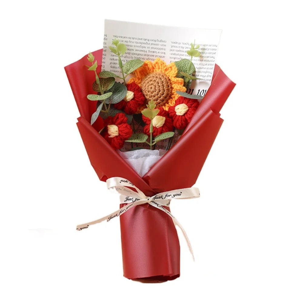A red handmade crochet bouquet featuring orange and yellow sunflowers and daisies.