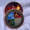 A round copper bar featuring fantasy art of the Goddess of Fire and the Goddess of Elements on a red metal mint.