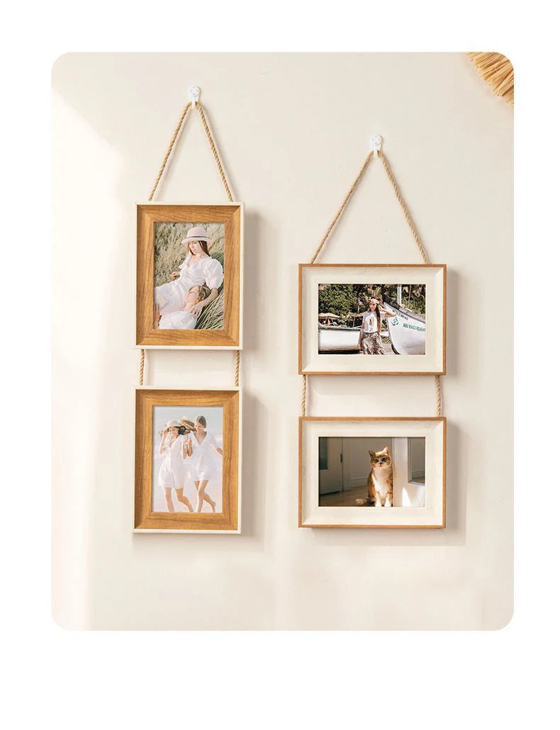 A set of three rustic wooden collage photo frames with natural twine hanging on a light wall.