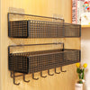 A set of dark brown metal wall mounted storage baskets designed for bunk beds and dorm rooms.