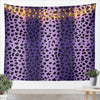 A purple leopard print tapestry wall hanging with warm string lights draped across it.