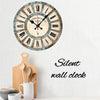 A round wooden wall clock with Roman numerals and a distressed finish, featuring the text Paris and Eiffel Tower.