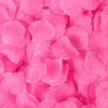 Close-up of vibrant pink simulation silk rose petals used for event decoration.