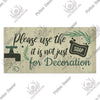 A rustic wooden sign with text that reads Please use the it is not just for Decoration