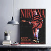 A vertical poster featuring the word NIRVANA and a silhouette of Kurt Cobain playing a guitar in grunge style.