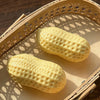 A yellow peanut-shaped stress ball is shown resting on a wooden tray.