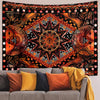 Bohemian sun and moon tapestry wall hanging featuring intricate geometric patterns in orange, black, and gold tones.