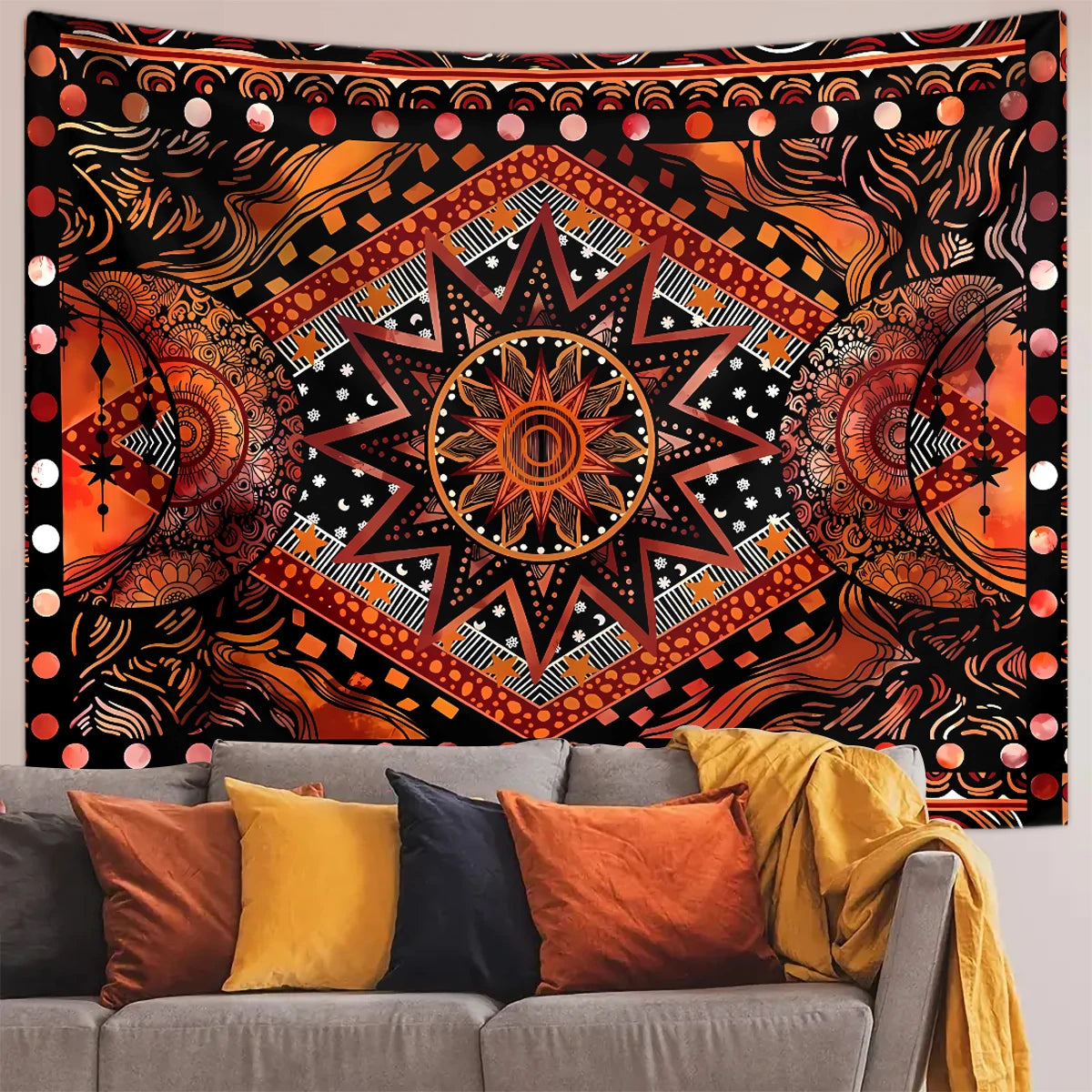 Bohemian sun and moon tapestry wall hanging featuring intricate geometric patterns in orange, black, and gold tones.