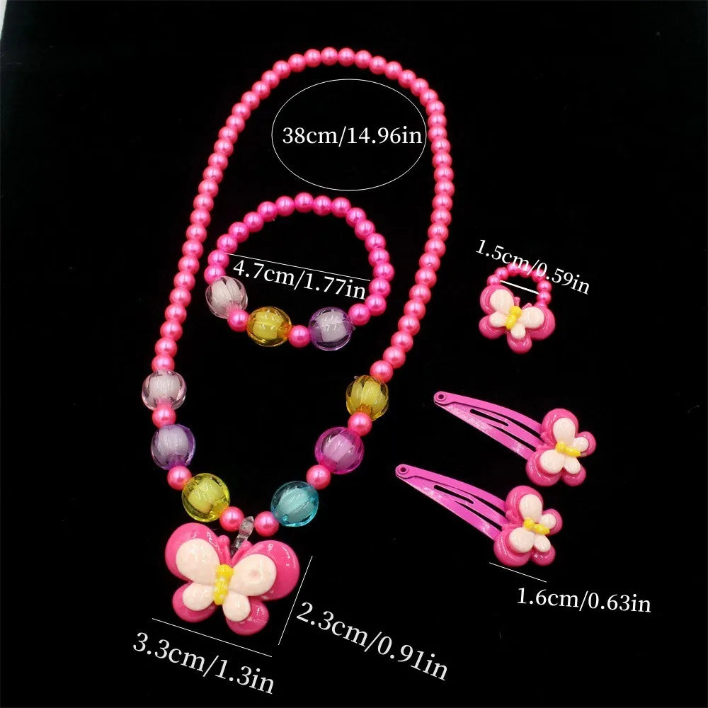 A set of pink and purple beaded jewelry including a necklace and butterfly hair clips.