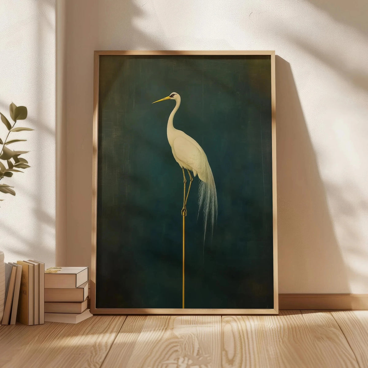 A vertical canvas print of a white crane against a dark teal background, framed in gold.