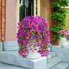 A vibrant display of artificial morning glory hanging vines in shades of purple and pink on a white pedestal.
