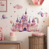 Wall decals featuring a pink castle and clouds on a white wall with pastel accents.
