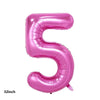 A pink foil balloon shaped like the number five for party decorations
