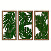 A set of three wooden leaf wall art panels featuring green tropical leaves cutouts.