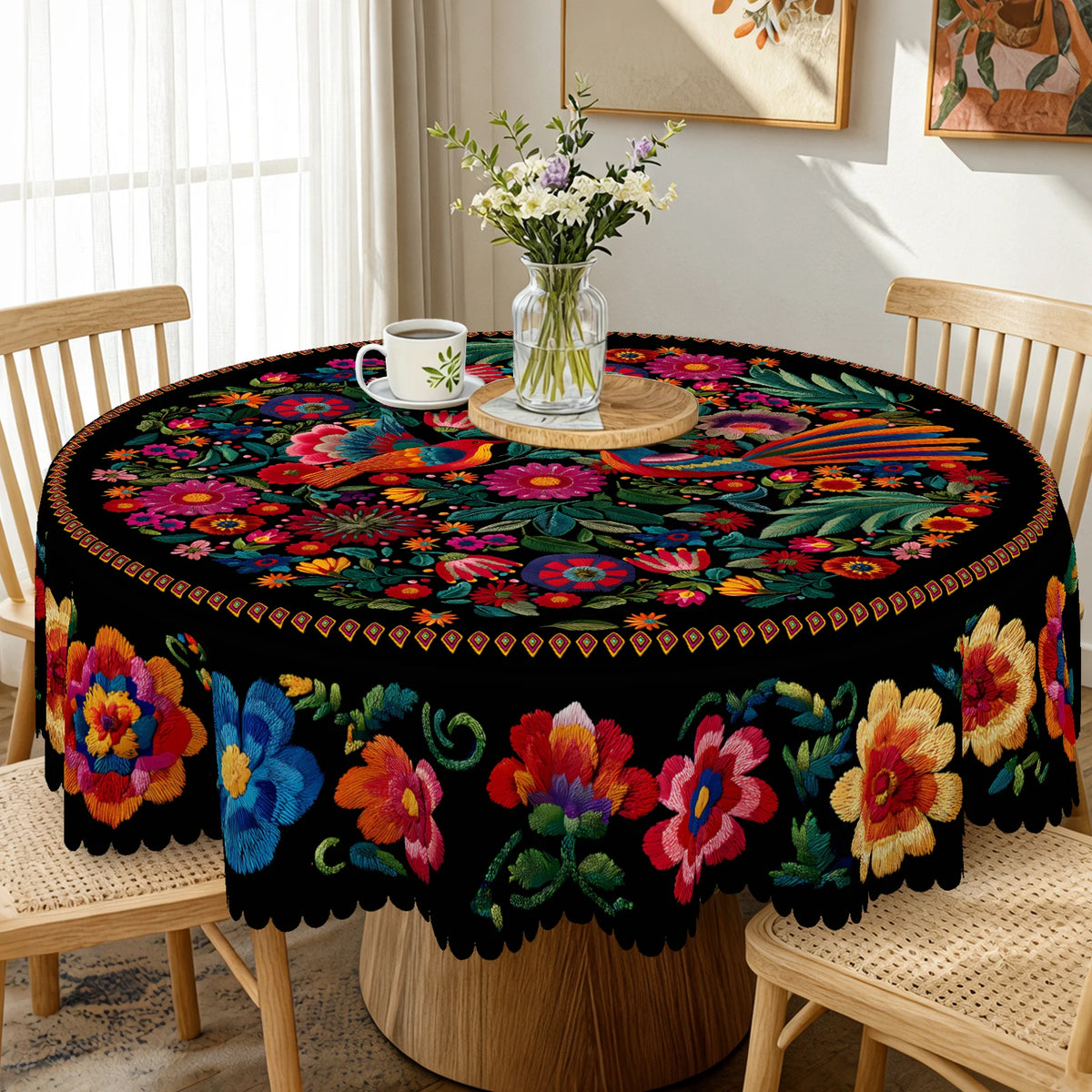 A vibrant Mexican style embroidered tablecloth featuring colorful floral patterns on a round table.