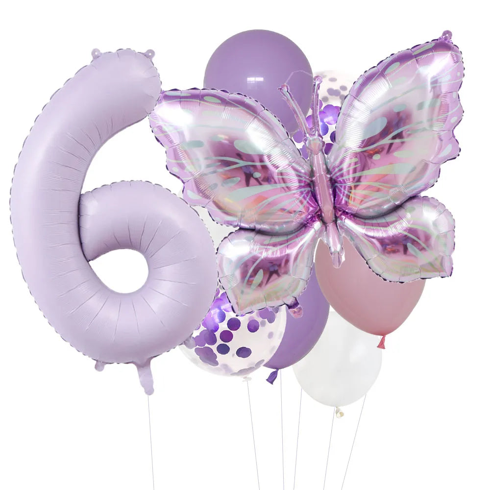 A set of purple butterfly foil balloons shaped like the number six and various other balloon shapes.