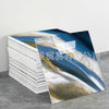 A stack of faux marble 3D self-adhesive wall tiles featuring blue, white, and gold marbled patterns.