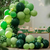 A lush green balloon garland arch kit featuring various shades of lime and dark green balloons for parties and events.