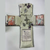 Handcrafted pocket shrine featuring a cross with floral embroidery and religious medallions.
