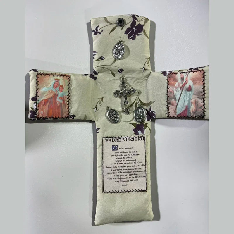 Handcrafted pocket shrine featuring a cross with floral embroidery and religious medallions.