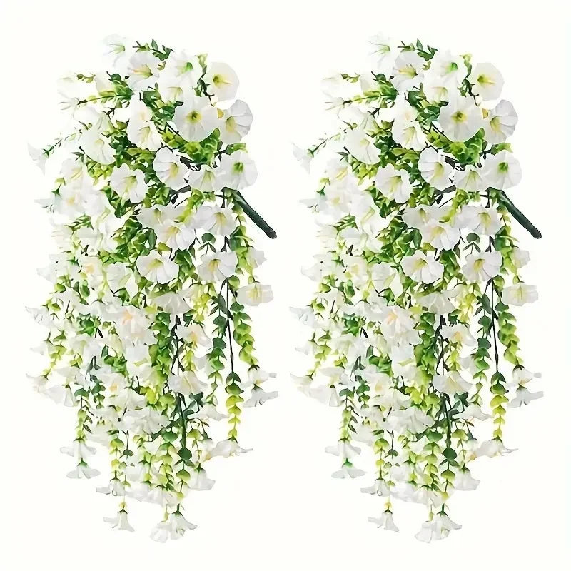 A set of two artificial morning glory and eucalyptus hanging floral decor featuring white flowers and green leaves.