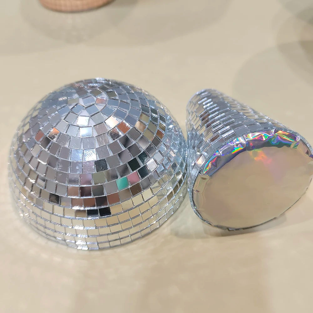 Silver, mushroom-shaped disco ball decoration with a reflective surface.