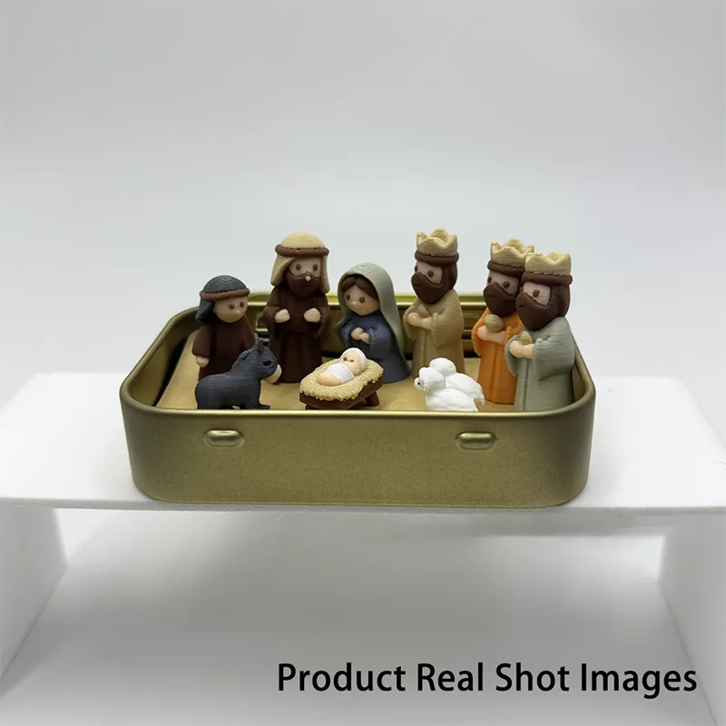 Miniature Nativity scene set featuring Mary, Jesus, shepherd, and animal figurines in a gold-colored box.