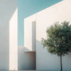 Minimalist white architecture featuring sharp geometric lines and a green tree silhouette against a clear blue sky.