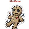 A cartoon figure made of tan resin with stitched features and small red and blue charms.