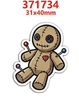 A cartoon figure made of tan resin with stitched features and small red and blue charms.