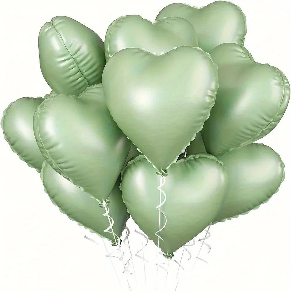 A bunch of ten light green heart-shaped foil balloons tied together for a celebration.