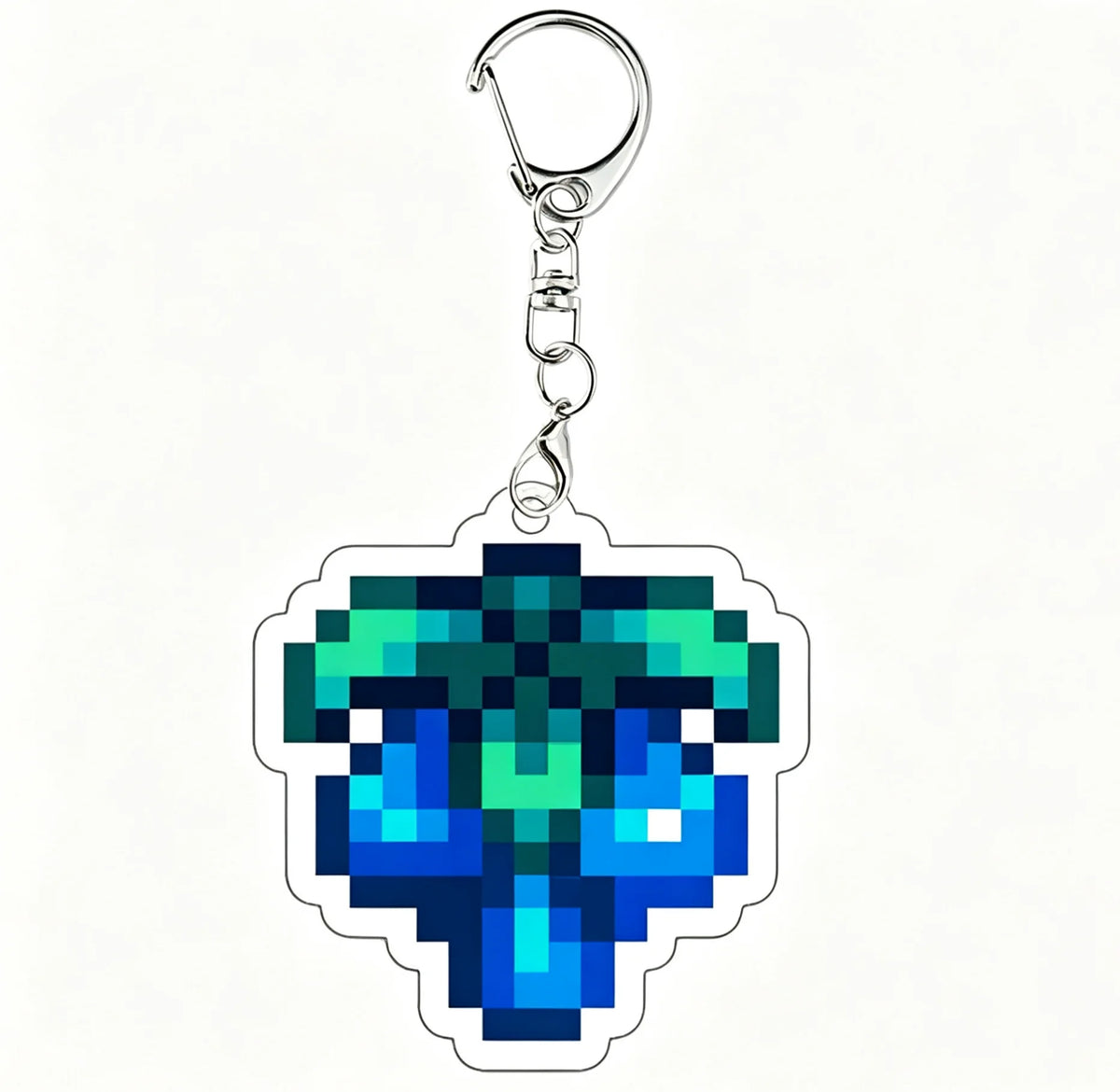 A clear acrylic keychain charm featuring a vibrant teal and blue gemstone design.