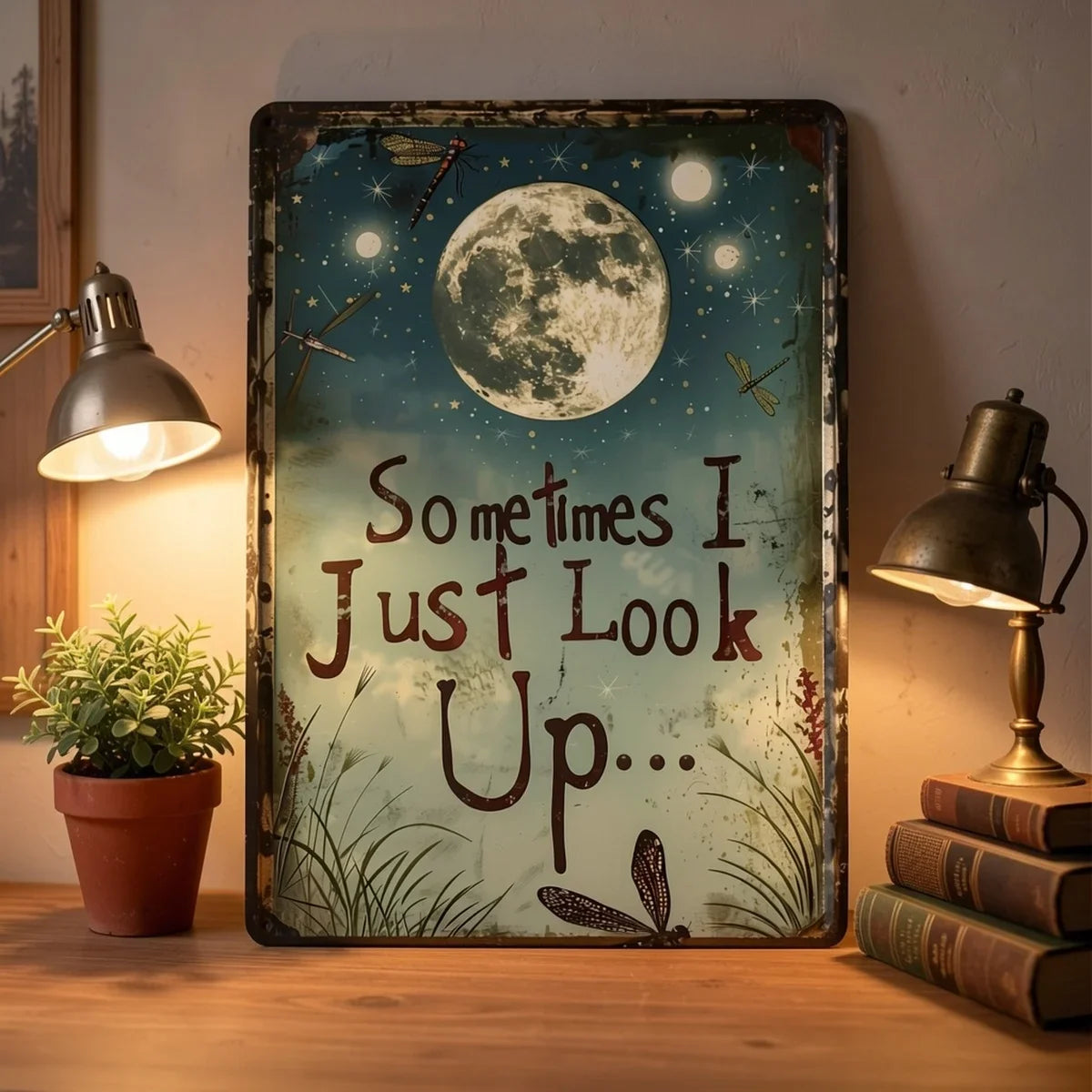 Vintage metal wall decor featuring a moon and dragonflies with the quote Sometimes I Just Look Up