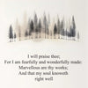 A minimalist canvas featuring a silhouette of evergreen trees against a light background with a Bible verse.