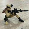 A female tactical rifleman desktop figurine holding an assault rifle.