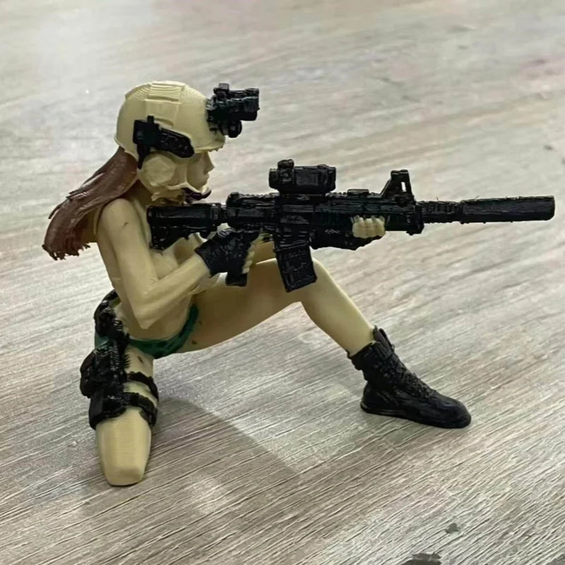 A female tactical rifleman desktop figurine holding an assault rifle.