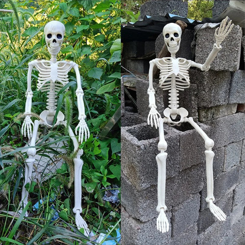 A white poseable human skeleton decoration measuring 40cm with movable bones displayed outdoors.