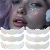 A set of holographic glitter heart temporary tattoos applied to a model's face.