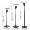 Set of three black metal taper candle holders with varying heights and bases