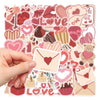 A hand holds a sheet of pink and red love-themed decorative stickers featuring hearts, guitars, and other symbols.