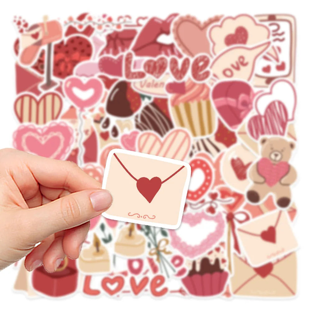 A hand holds a sheet of pink and red love-themed decorative stickers featuring hearts, guitars, and other symbols.