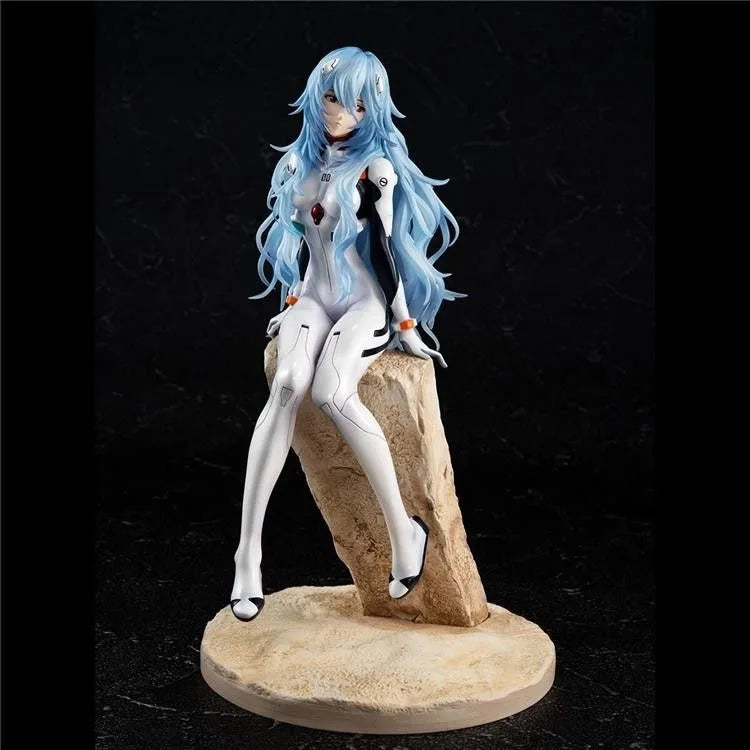 Anime portrait PVC figure of a female character with blue hair and white outfit standing on a natural stone base