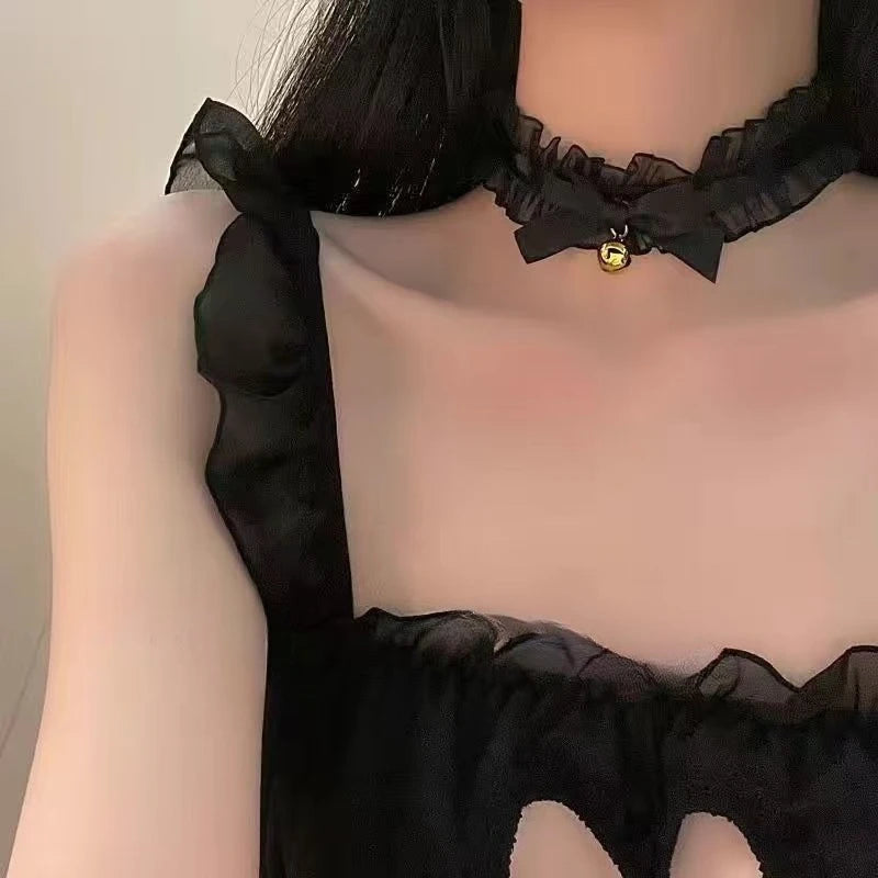 A black lace choker and matching headband with a bell detail displayed on a mannequin.