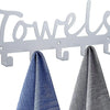 Silver metal wall-mounted towel rack with seven hooks displaying folded blue and gray towels